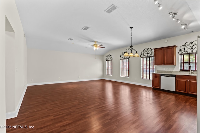 kitchen featuring dark wood-style floors, light countertops, visible vents, stainless steel dishwasher, and ceiling fan with notable chandelier