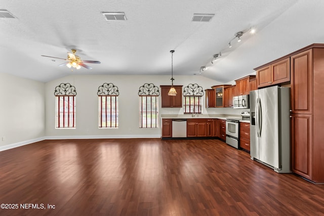 kitchen with light countertops, a ceiling fan, visible vents, lofted ceiling, and appliances with stainless steel finishes