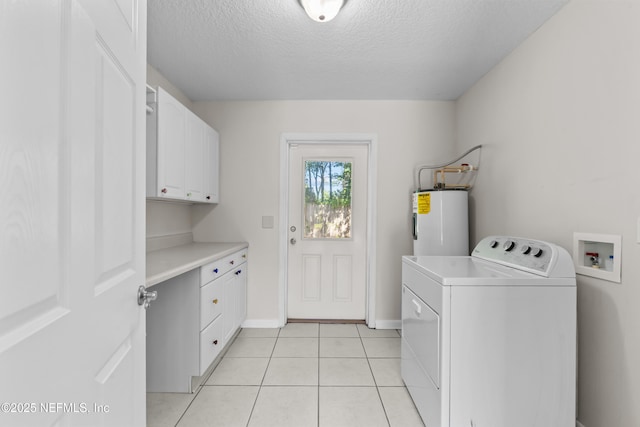 laundry area with light tile patterned floors, a textured ceiling, electric water heater, cabinet space, and washer / dryer