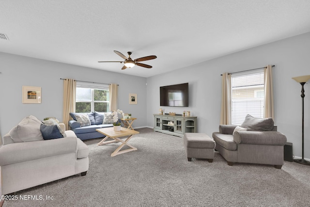 3699 Summit Oaks Dr, Green Cove Springs, FL 32043 - carpeted living area featuring visible vents, ceiling fan, baseboards, and a textured ceiling