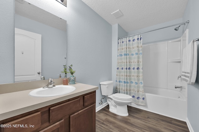 3699 Summit Oaks Dr, Green Cove Springs, FL 32043 - full bath featuring vanity, a textured ceiling, toilet, shower / bathtub combination with curtain, and wood finished floors