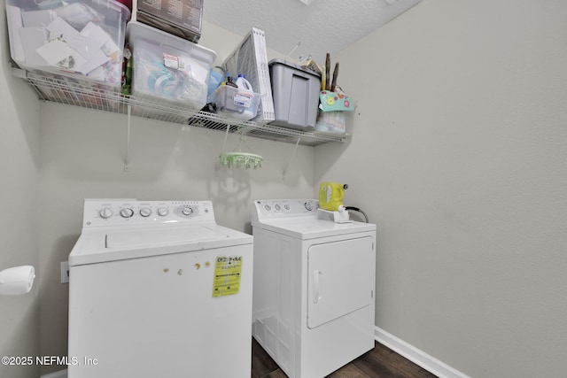 3699 Summit Oaks Dr, Green Cove Springs, FL 32043 - laundry area with laundry area, dark wood finished floors, independent washer and dryer, a textured ceiling, and baseboards