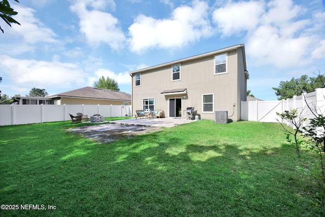 3699 Summit Oaks Dr, Green Cove Springs, FL 32043 - back of property featuring central AC, a fenced backyard, a patio, and a lawn