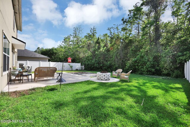 3699 Summit Oaks Dr, Green Cove Springs, FL 32043 - view of yard featuring an outdoor living space with a fire pit, a fenced backyard, and a patio