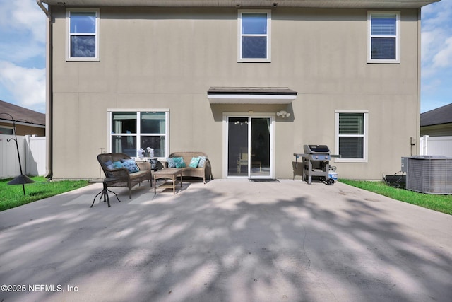3699 Summit Oaks Dr, Green Cove Springs, FL 32043 - back of house featuring a patio, central air condition unit, stucco siding, outdoor lounge area, and fence