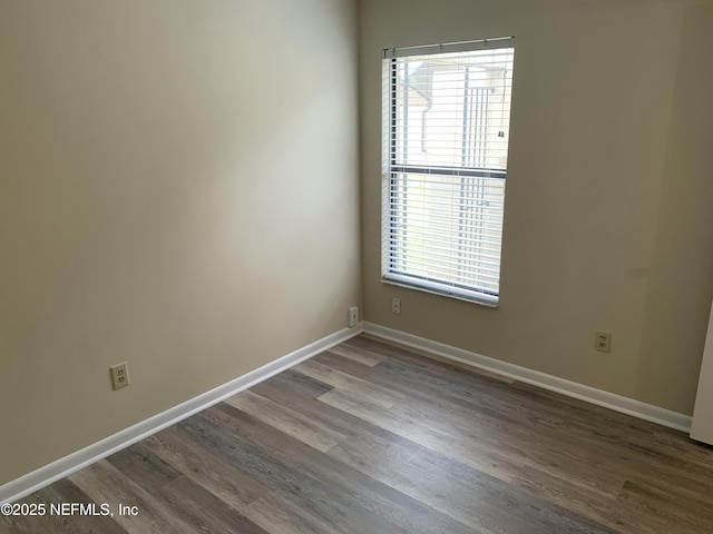 5473 Pinehaven Ct, Jacksonville, FL 32244 - spare room with baseboards and wood finished floors