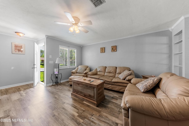1648 Rhonda Dr, Middleburg, FL 32068 - living room featuring crown molding, wood finished floors, a ceiling fan, and visible vents