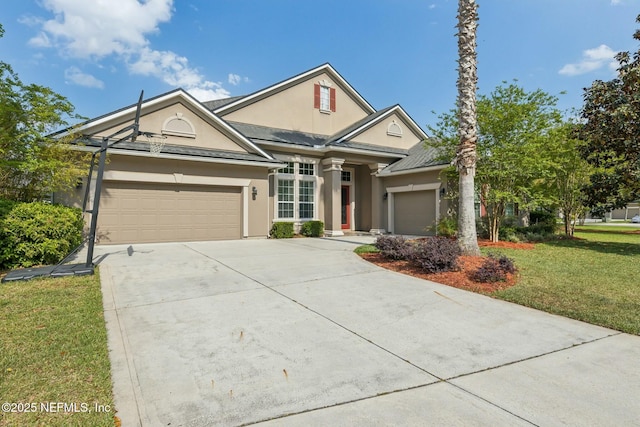 244 W Berkswell Dr, Saint Johns, FL 32259 - view of front of house featuring driveway, a front lawn, a garage, and stucco siding