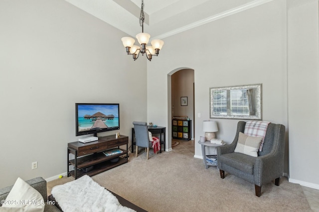 244 W Berkswell Dr, Saint Johns, FL 32259 - living area with an inviting chandelier, carpet, arched walkways, a towering ceiling, and baseboards