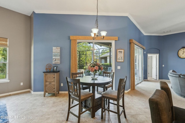 244 W Berkswell Dr, Saint Johns, FL 32259 - dining space with high vaulted ceiling, light tile patterned floors, ornamental molding, a chandelier, and baseboards