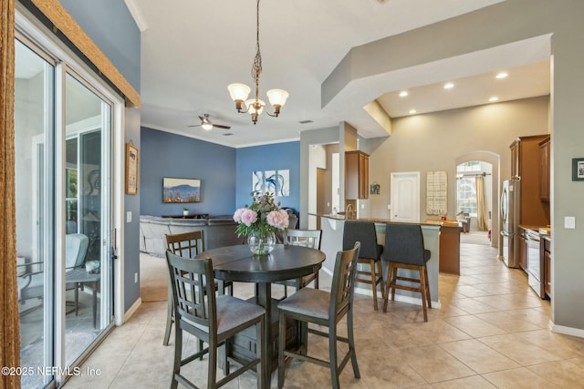 244 W Berkswell Dr, Saint Johns, FL 32259 - dining room featuring arched walkways, ornamental molding, recessed lighting, ceiling fan with notable chandelier, and light tile patterned flooring