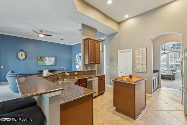 244 W Berkswell Dr, Saint Johns, FL 32259 - kitchen with ceiling fan, a peninsula, a kitchen island, appliances with stainless steel finishes, and a sink