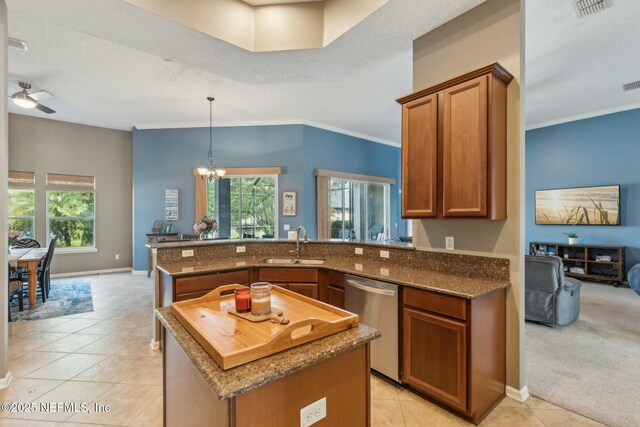 244 W Berkswell Dr, Saint Johns, FL 32259 - kitchen with brown cabinetry, a peninsula, a healthy amount of sunlight, dishwasher, and a sink