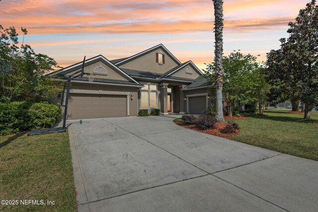 244 W Berkswell Dr, Saint Johns, FL 32259 - view of front of house with an attached garage, concrete driveway, a front yard, and stucco siding