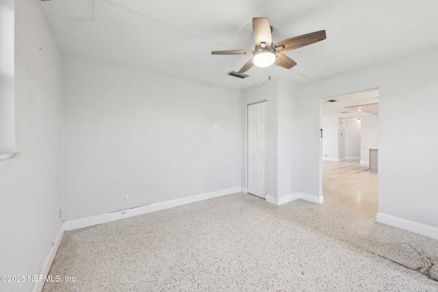 16 San Jose Cir, Ormond Beach, FL 32176 - unfurnished room featuring a ceiling fan, baseboards, visible vents, and speckled floor
