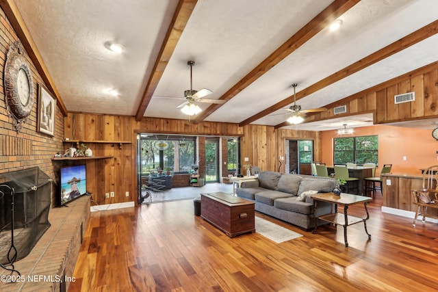 5822 Silver Sands Cir, Keystone Heights, FL 32656 - living room with a wealth of natural light, wood walls, and visible vents