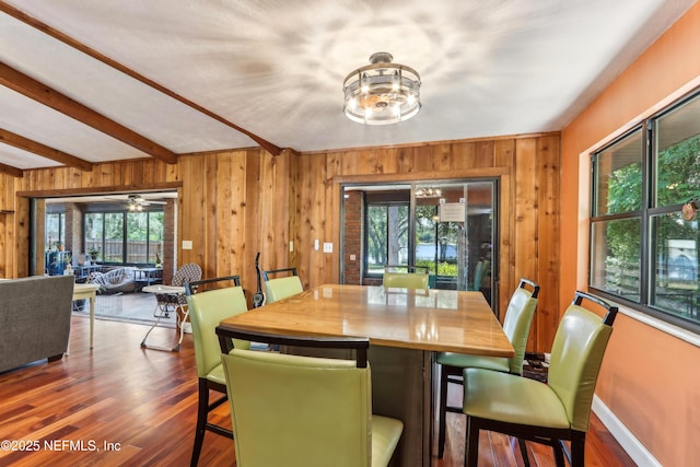 5822 Silver Sands Cir, Keystone Heights, FL 32656 - dining space featuring wood finished floors, wooden walls, and baseboards