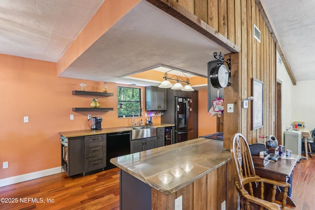 5822 Silver Sands Cir, Keystone Heights, FL 32656 - kitchen with dark wood-style flooring, stainless steel countertops, black appliances, wine cooler, and a sink