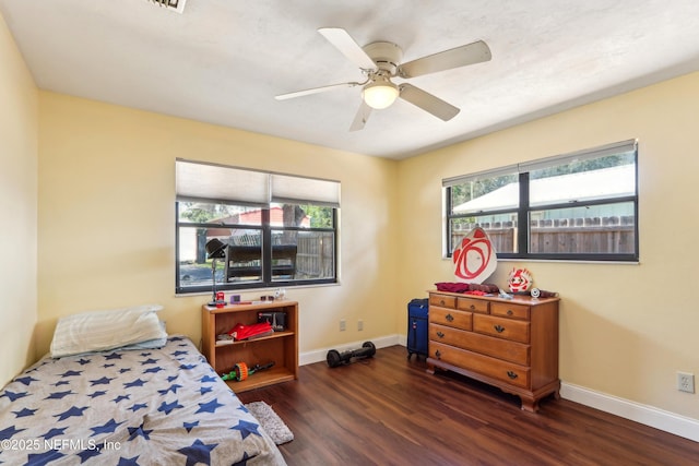 5822 Silver Sands Cir, Keystone Heights, FL 32656 - bedroom with wood finished floors, baseboards, and multiple windows