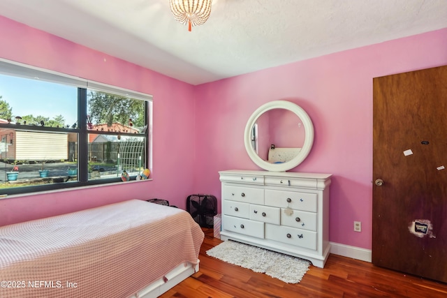 5822 Silver Sands Cir, Keystone Heights, FL 32656 - bedroom with baseboards and wood finished floors