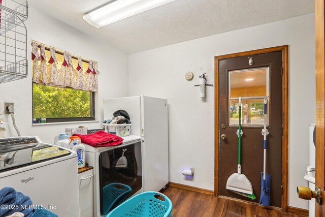 5822 Silver Sands Cir, Keystone Heights, FL 32656 - laundry room with laundry area, wood finished floors, baseboards, and washer and clothes dryer