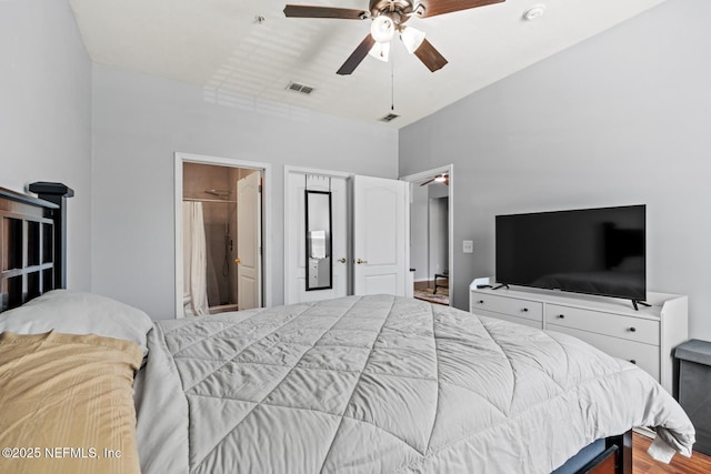 8601 Beach Blvd Unit 905, Jacksonville, FL 32216 - bedroom with visible vents, a ceiling fan, and wood finished floors