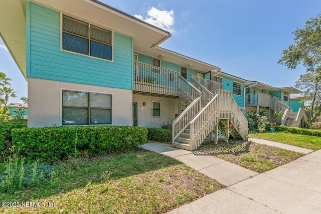 view of property featuring stairs