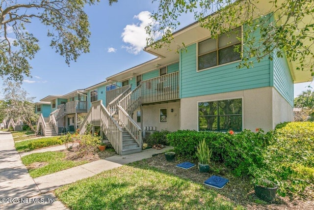 view of property featuring stairs