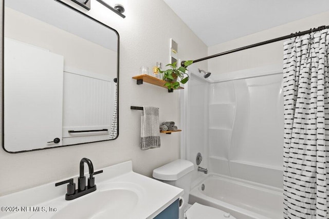 bathroom featuring toilet, shower / tub combo, and vanity