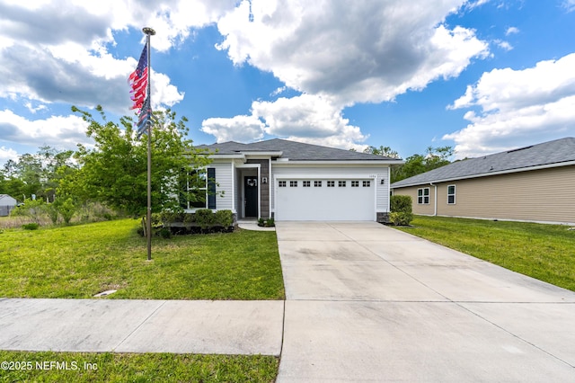 view of front of home featuring an attached garage, a front lawn, and concrete driveway