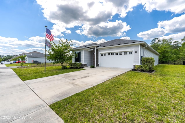view of front facade with driveway, a garage, and a front lawn