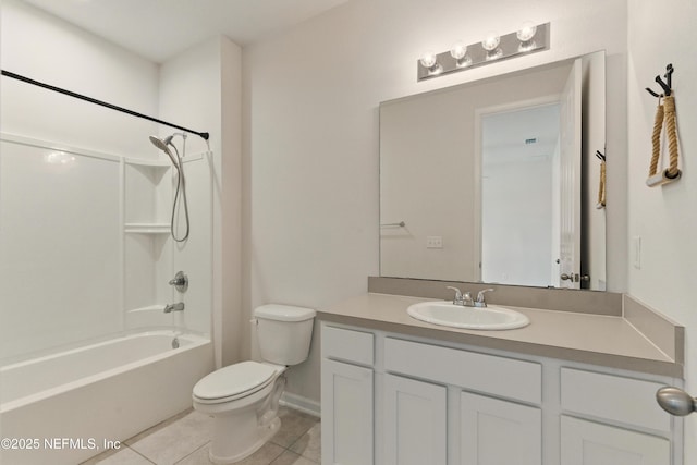 bathroom featuring tile patterned floors, vanity, toilet, and shower / washtub combination