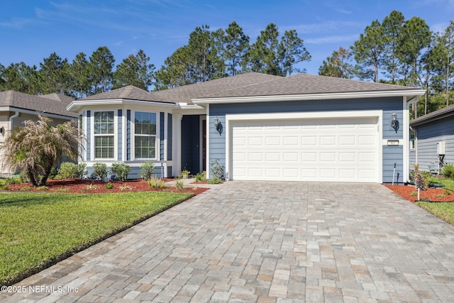 83 Woodgate Dr, Ponte Vedra, FL 32081 - ranch-style house with a front yard, a garage, driveway, and roof with shingles