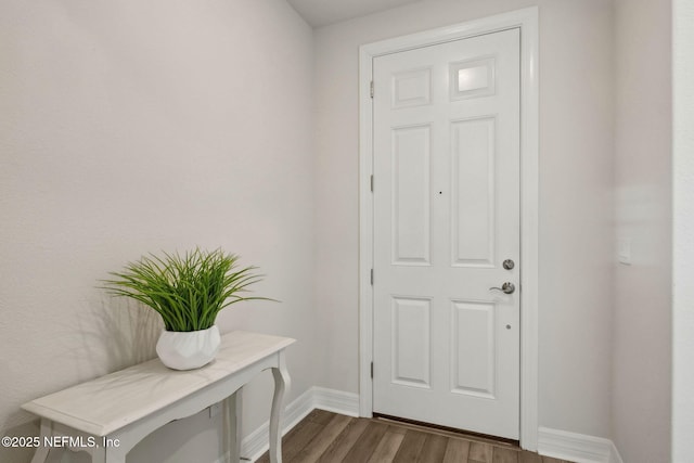 83 Woodgate Dr, Ponte Vedra, FL 32081 - doorway featuring dark wood-type flooring and baseboards