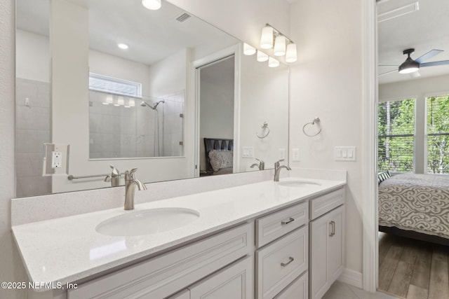 83 Woodgate Dr, Ponte Vedra, FL 32081 - bathroom featuring tiled shower, double vanity, a sink, and connected bathroom