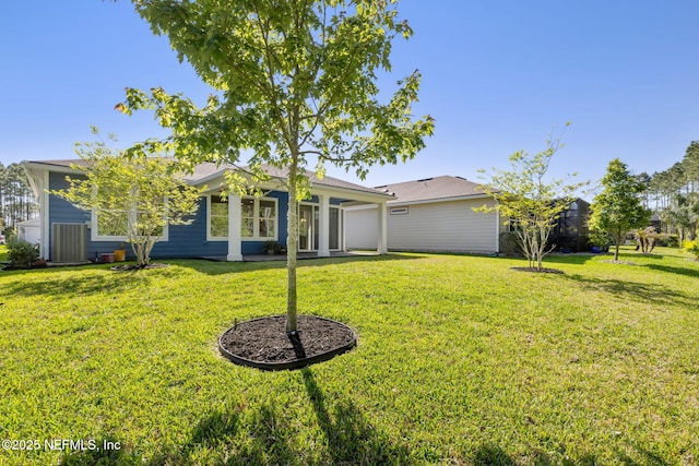 83 Woodgate Dr, Ponte Vedra, FL 32081 - rear view of house with a yard