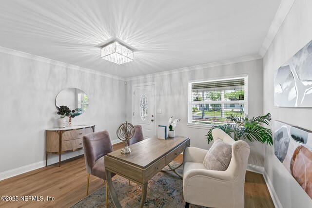 1018 14th Ave N, Jacksonville Beach, FL 32250 - dining area featuring crown molding, wood finished floors, a notable chandelier, and baseboards