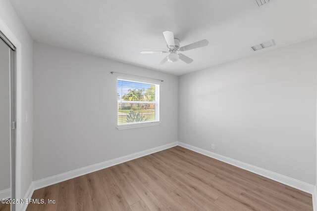 1018 14th Ave N, Jacksonville Beach, FL 32250 - empty room with light wood-type flooring, baseboards, a ceiling fan, and visible vents
