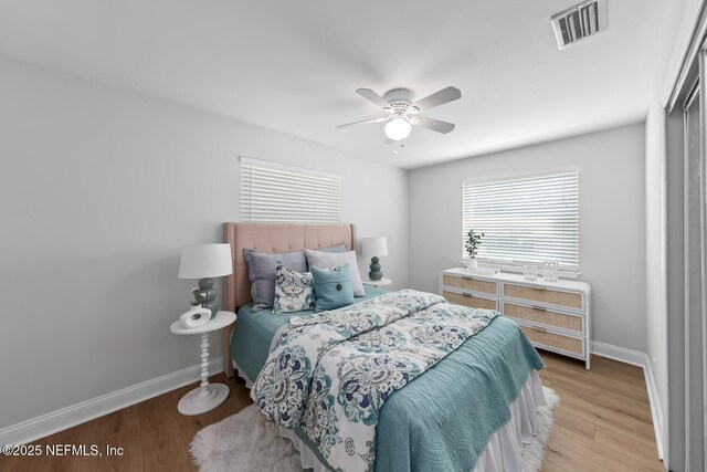 1018 14th Ave N, Jacksonville Beach, FL 32250 - bedroom featuring light wood-type flooring, visible vents, baseboards, and a ceiling fan
