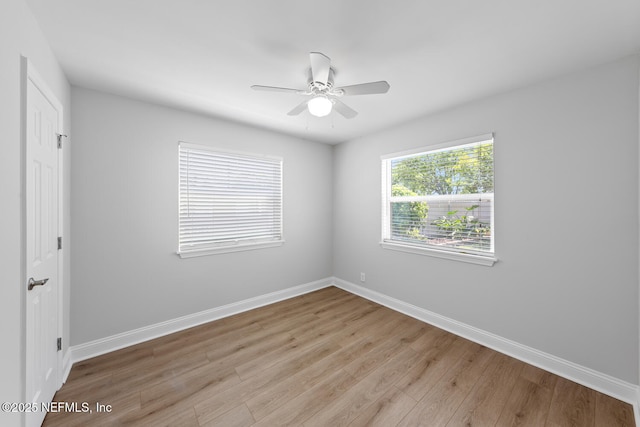 1018 14th Ave N, Jacksonville Beach, FL 32250 - empty room with light wood-type flooring, ceiling fan, and baseboards
