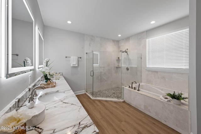 1018 14th Ave N, Jacksonville Beach, FL 32250 - full bath featuring a bath, a sink, recessed lighting, wood finished floors, and a stall shower