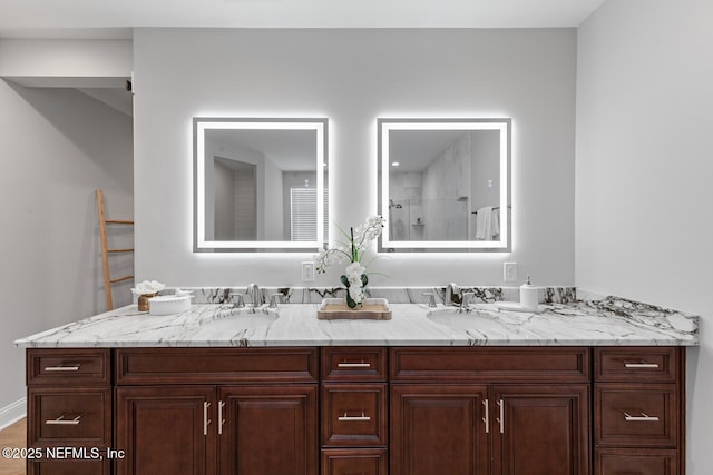 1018 14th Ave N, Jacksonville Beach, FL 32250 - full bathroom with double vanity, a sink, and a shower with door