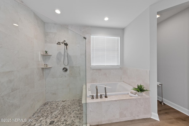 1018 14th Ave N, Jacksonville Beach, FL 32250 - bathroom featuring a bath, a tile shower, recessed lighting, and wood finished floors