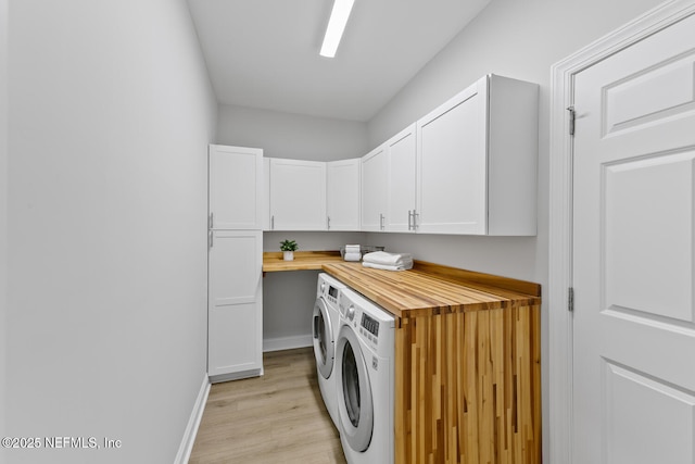 1018 14th Ave N, Jacksonville Beach, FL 32250 - laundry area with light wood-style flooring, independent washer and dryer, baseboards, and cabinet space