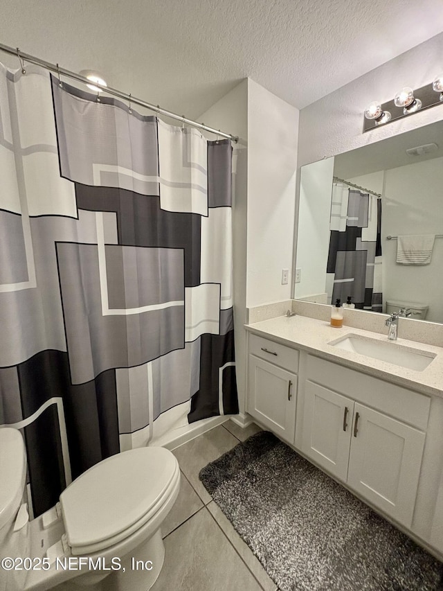 full bathroom with vanity, a textured ceiling, a shower with shower curtain, and toilet