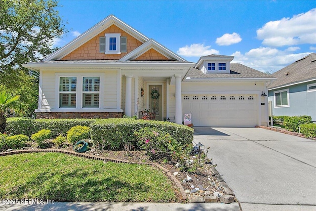225 Garden Wood Dr, Ponte Vedra, FL 32081 - craftsman-style home with a garage, stone siding, and driveway