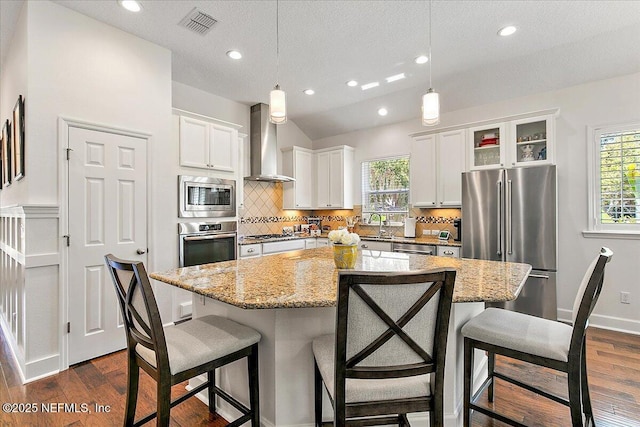 225 Garden Wood Dr, Ponte Vedra, FL 32081 - kitchen with decorative backsplash, wall chimney exhaust hood, a wealth of natural light, and stainless steel appliances