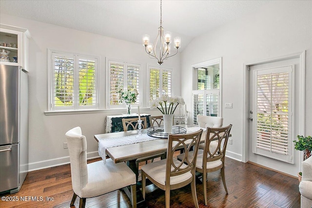 225 Garden Wood Dr, Ponte Vedra, FL 32081 - dining room featuring dark wood-type flooring, baseboards, a chandelier, and a healthy amount of sunlight
