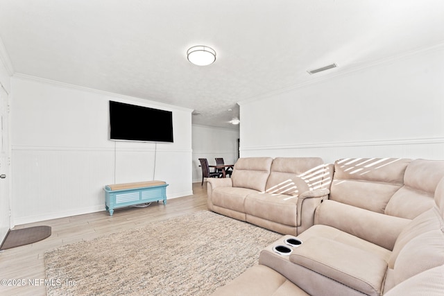 8871 Manson Cir, Jacksonville, FL 32220 - living area featuring ornamental molding, visible vents, and wood finished floors