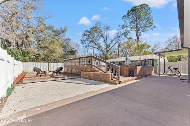 8871 Manson Cir, Jacksonville, FL 32220 - view of patio / terrace featuring a fenced backyard and a wooden deck